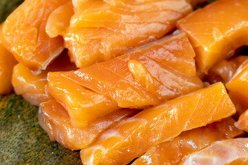 Sliced red trout meat with sea salt