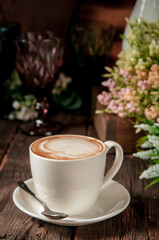 cup of coffee with flowers