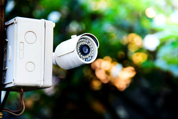 Bokeh background, CCTV camera, equipment for security system and copy space for design