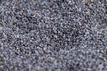 a close-up of a pile of poppy seeds used in cooking