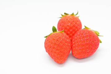beautiful three fresh red strawberry isolated on white background