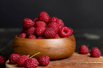 Harvested red ripe raspberries in the kitchen
