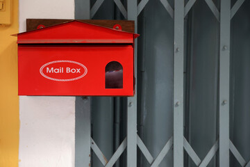 Red mailbox Postbox on  silver steel door