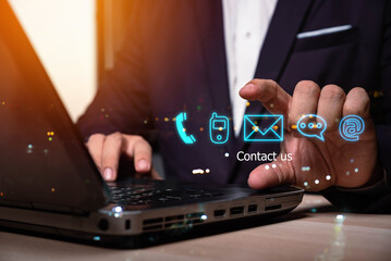 Businessman using Smart Phone with the email, call phone, address, Chat message icons. Customer support hotline Contact us people connection