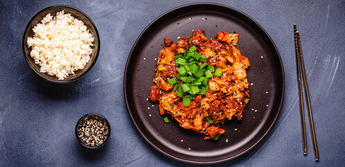 Fried kimchi with pork onions and spices. Traditional Korean food