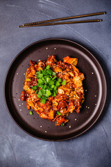 Fried kimchi with pork onions and spices. Traditional Korean food