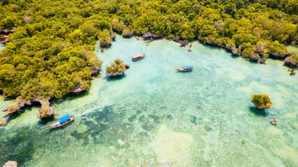 A wooden fishing boat with a traditional design, commonly found in Tanzania and located in the Indian Ocean near Zanzibar.