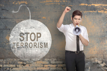 Businessman holding a megaphone with stop terrorism sign