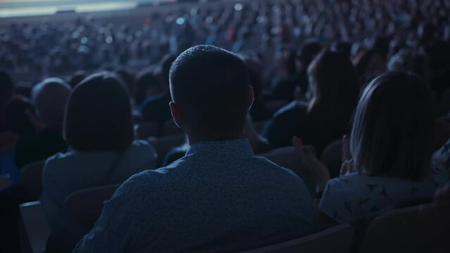 Business People Sitting in Audience and Clapping Hands at Conference Talk. Woman and Man Working at Public Discussion and Applauding Happy to Coaching Speaker on Stage. Concept of Cheering Applause