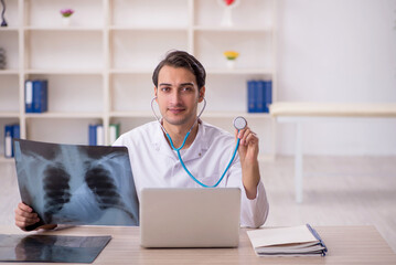 Young male doctor radiologist working in the clinic
