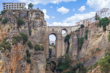 views from the river of the new bridge of Ronda over the cliff .Andalusia,malaga , Spain