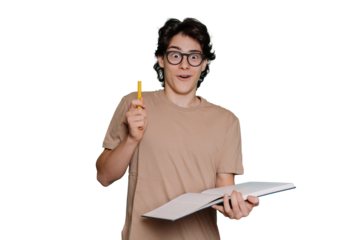 Excited caucasian teen boy in glasses and beige t-shirt holds book and pen, got idea stands against transparent background with amazed face expression. Creative American guy got solution. Education
