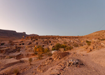 Panoramic view of the ancient rocky village of Meymand at sunset near Shahr-e Babak city in Kerman Province, Iran