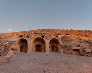View of the entrance at the Religious Center in the ancient rocky village of Meymand at sunset located near Shahr-e Babak city in Kerman Province, Iran