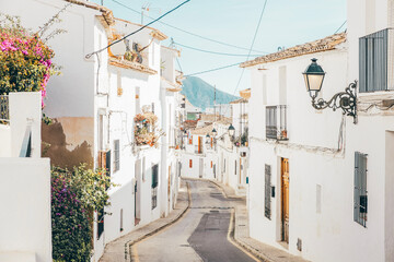 Fototapeta na wymiar Altea old town with narrow streets and whitewashed houses. Architecture in small picturesque village of Altea near Mediterranean sea, Alicante province, Valencian Community, Spain