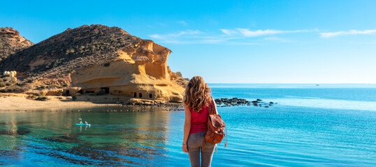Woman tourist enjoying beautiful beach and Andalusian coast in Spain - Powered by Adobe