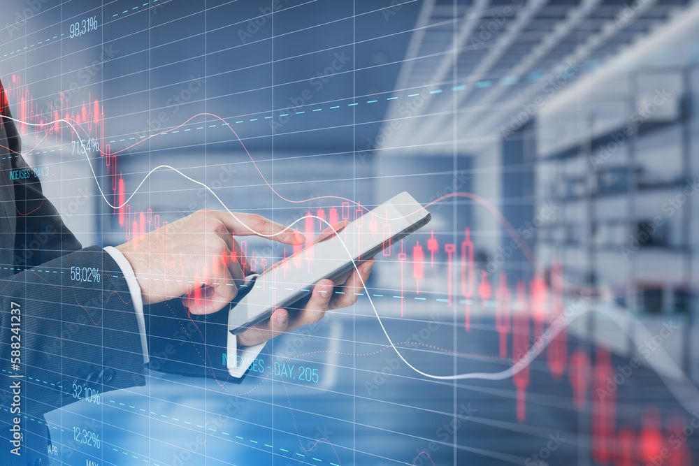 Poster close up of businessman hand pointing at mobile phone with falling red crisis forex chart on blurry 