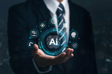 Businessman holding brain working of Artificial Intelligence (AI) in the futuristic business. access to information and data in online network,  AI, Artificial intelligence, innovation and technology.