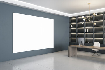 Modern gray office interior with blank white mock up banner on wall, bookshelf and desktop with equipment. 3D Rendering.