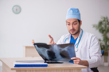 Young male doctor radiologist working in the clinic