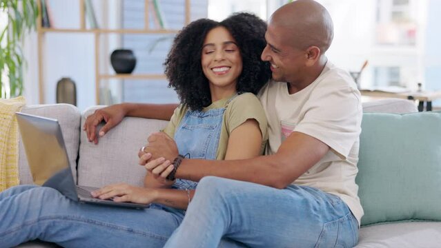 Laptop, couple and high five on sofa in home living room for celebration, success or achievement. Winner, computer and happy or excited man and woman holding hands for good news or congratulations.