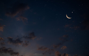 Obraz na płótnie Canvas Eid Al Adha,Eid Al Fifr Adha Mubrak Arabic Background Concept,Crescent Moon with Star on Dark Night Sky Dusk Nature Landscape,Symbols Moonlight Muslim Islamic New Year Muharram Religion.