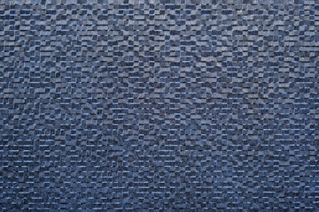 Beautiful abstract background of blue ceramic tiles with splashes of gold.