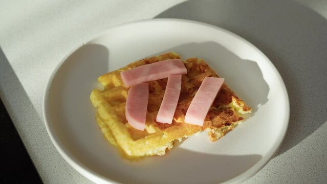 Waffle pizza with ham and cheese. Hybrid waffles with pizza, piffle