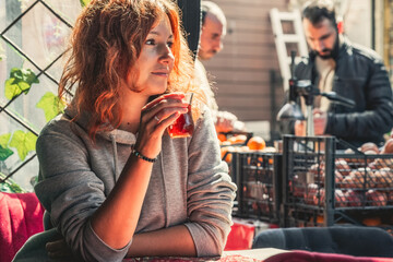 Young pretty woman having turkish tea in the cafe of Istanbul