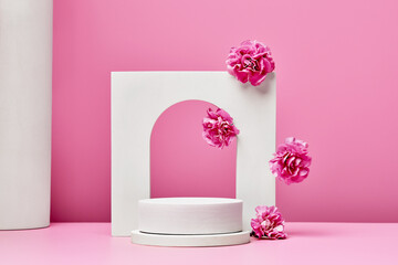 white podium with pink flowers, and arch on pastel pink background