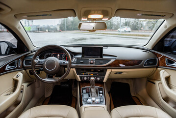 Detail of car interior inside. Luxury modern car interior business class. Steering wheel, shift...