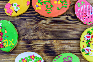 Easter cookies in plate on a wooden background. Top view