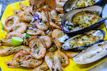 Prepared shrimps and oysters on the plate