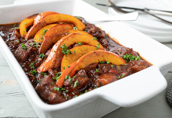 Poultry goulash with roasted pumpkin topping - obrazy, fototapety, plakaty
