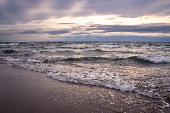Cloudy winter seaside landscape. Cloudy day on the beach in Gdynia, Poland.