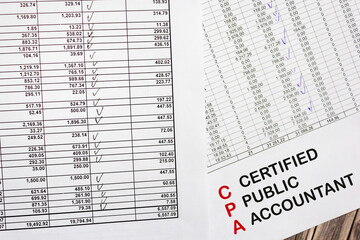 Paper with CPA - certified accountant on documents and desktop