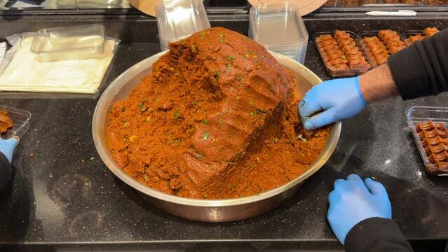 Turkish raw meatballs. Raw meatballs in a copper pan. local name ciğ k&ouml;fte