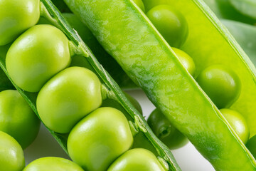 Rows of perfect green peas in pod close-up.