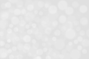White and gray bokeh background.  Photo can be used for the concept of Christmas, New Year and all celebration background concepts. 