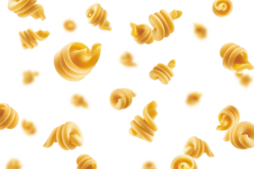 Falling raw Funghetti, uncooked Italian Pasta, isolated on white background, selective focus