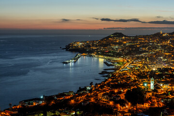 Aerial cityscape of Illuminated Funchal, Madeira at twilight