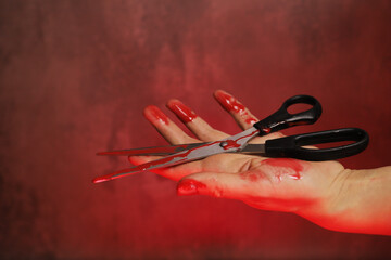 bloody hand holding big bloody scissors on a gray background, the concept of domestic murder, violence - obrazy, fototapety, plakaty