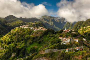 Fototapeta na wymiar Madeira landscape with green hills and mountains village Ribeiro Frio. Wild nature in Madeira, Portugal