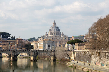 Fototapeta premium Rome under the snow. Vatican City in Italy on a summer day. St. Peter's basilica in the background, St. Angel's caste and bridge.