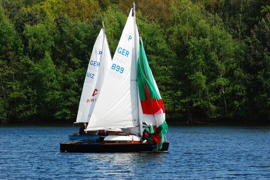Colorful sailboats on the Sechs-Seen-Platte lake in Duisburg, Germany.