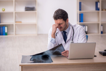Young male doctor radiologist working in the clinic