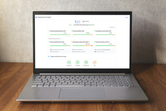 Google PageSpeed Insights on laptop screen with Core Web Vitals. Testing page speed for SEO. Warsaw, Poland - October 26, 2022.