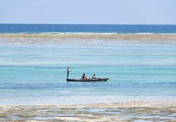 Wooden sailboat in a sea with tourists 