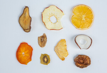 Dried fruits isolated on white background. Healthy eating concept. Top view. Healthy vegetarian food concept. Dried fruit chips.