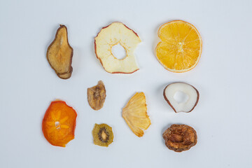 Dried fruits isolated on white background. Healthy eating concept. Top view. Healthy vegetarian food concept. Dried fruit chips.